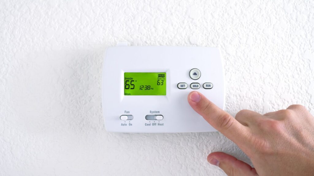 a thermosetat being adjusted