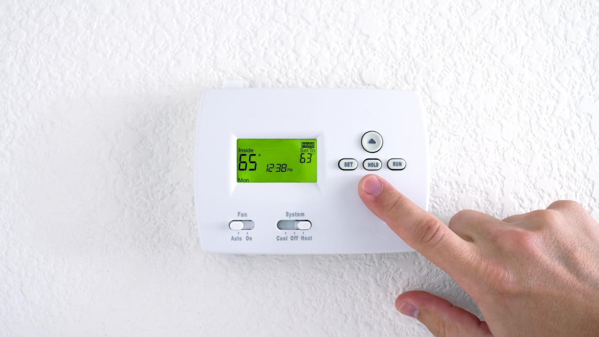 a thermosetat being adjusted