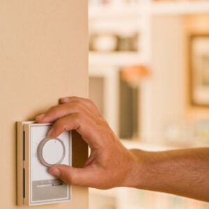 hand moving thermostat