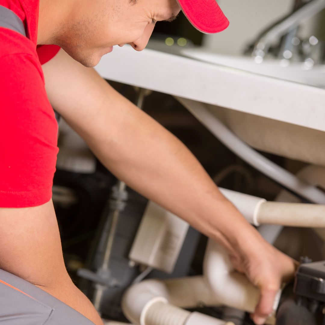 Plumber working on some pipes