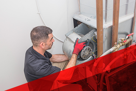 a professional removing a part from an ac unit