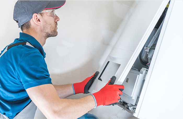 person repairing furnace