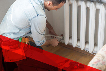 person repairing radiator