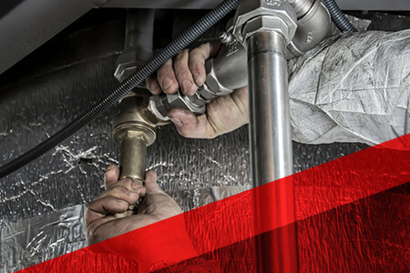 person repairing pipes