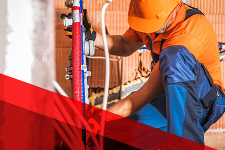 technician installing pipes