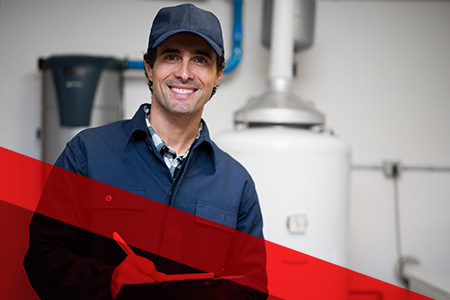 a professional with a checklist in front of a water heater