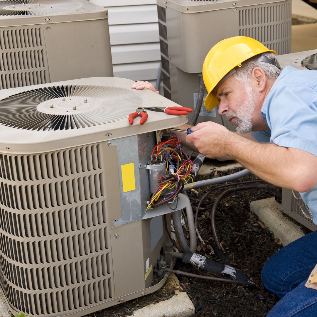 ac repair tech working