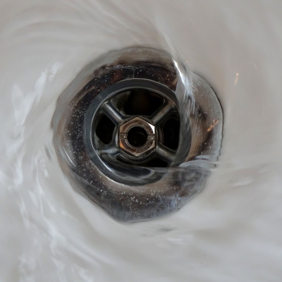 water flowing down a drain