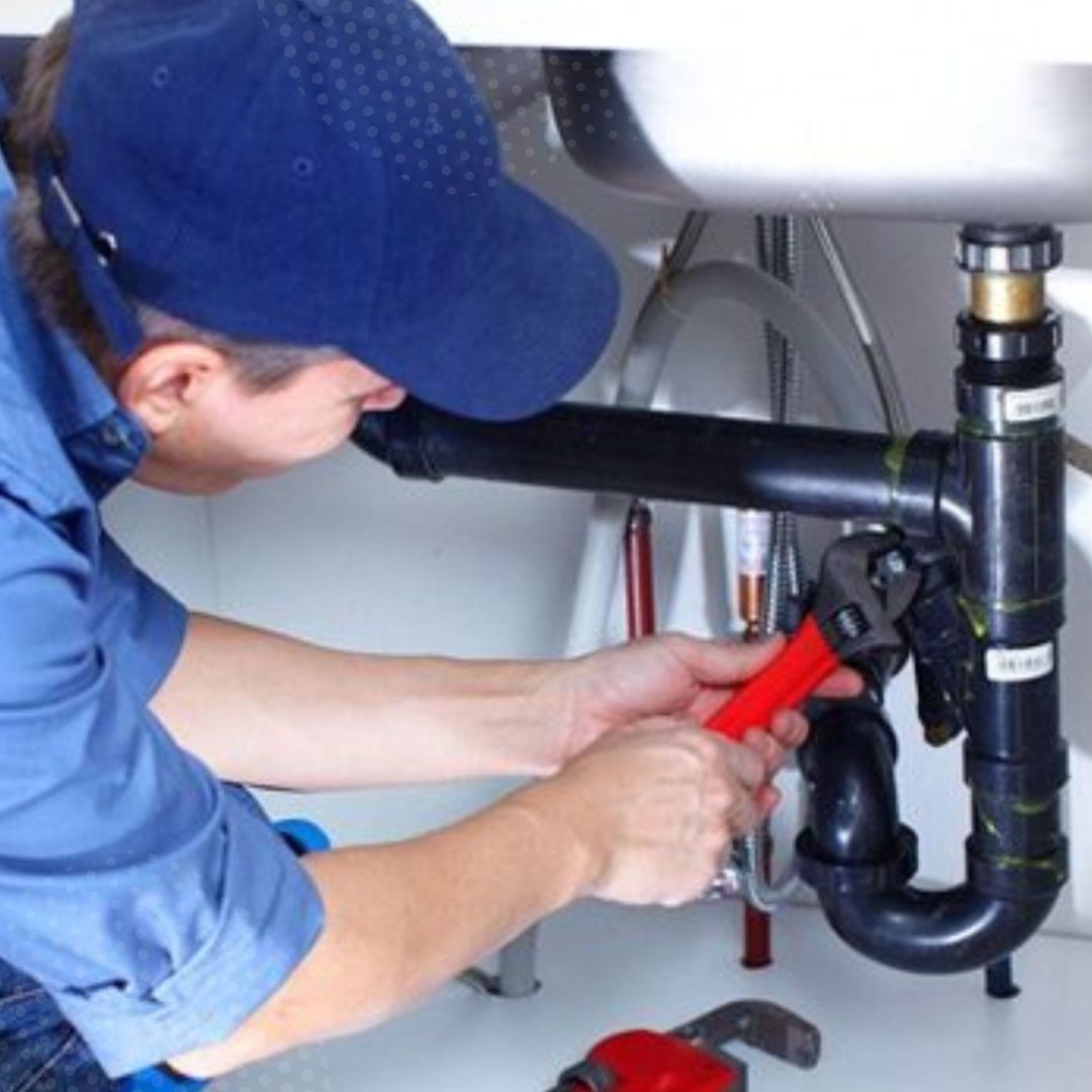 a plumber repairing a sink