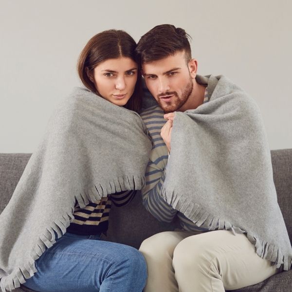 a couple feeling cold